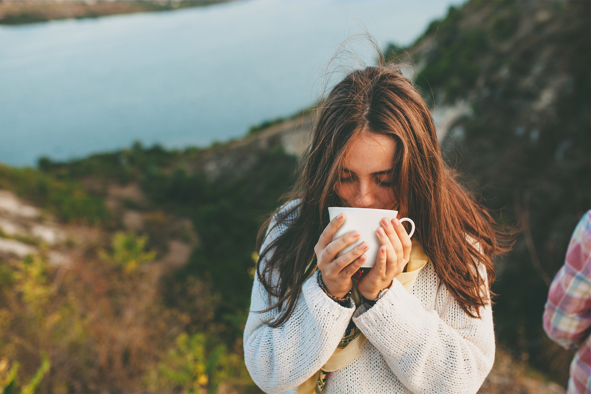 Teenage girl drinking coffee.